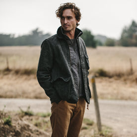 Our fit model in a field wearing his vertical jacket, Outerwear by Taylor Stitch