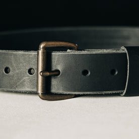 material shot of the belt buckle on The Standard Belt in Black, Accessories by Taylor Stitch