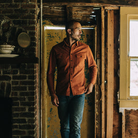 Fit model walking in The Yosemite Shirt in Copper, Wovens by Taylor Stitch