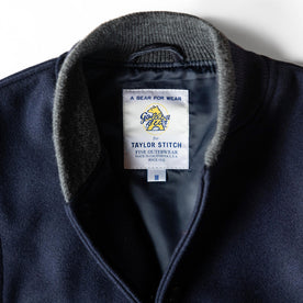 material shot of the Golden Bear label on The Golden Bear Snap Bomber in Midnight Wool, Outerwear by Taylor Stitch