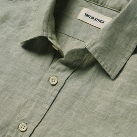 material shot of the collar and buttons on The Short Sleeve California in Army Hemp, Wovens by Taylor Stitch