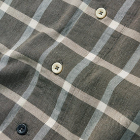 material shot of the buttons on The Short Sleeve Hawthorne in Espresso Plaid, Wovens by Taylor Stitch