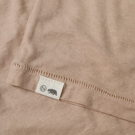 material shot of the hem logo of The Cotton Hemp Tee in Khaki, Knits by Taylor Stitch