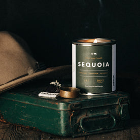 material shot of flatlay of The Camp Candle in Sequoia, Accessories by Taylor Stitch