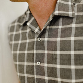 fit model posing in The Short Sleeve Hawthorne in Espresso Plaid, Wovens by Taylor Stitch