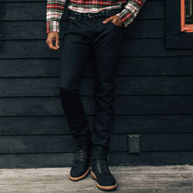 our fit model wearing The Slim Jean in Black Selvage, Denim by Taylor Stitch