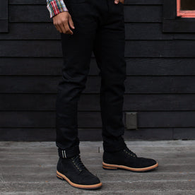 our fit model wearing The Slim Jean in Black Selvage, Denim by Taylor Stitch