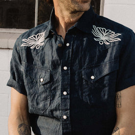 fit model wearing The Embroidered Short Sleeve Western in Indigo Linen, Wovens by Taylor Stitch