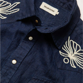 material shot of the collar and buttons on The Embroidered Short Sleeve Western in Indigo Linen, Wovens by Taylor Stitch