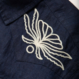 material shot of the embroidered yokes on The Embroidered Short Sleeve Western in Indigo Linen, Wovens by Taylor Stitch