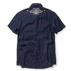 flatlay of The Embroidered Short Sleeve Western in Indigo Linen, from the back, Wovens by Taylor Stitch