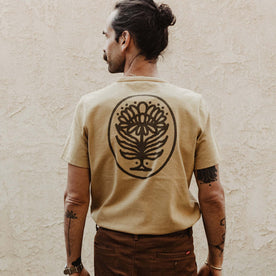 fit model facing the back in The Heavy Bag Tee in Khaki Dahlia, Knits by Taylor Stitch