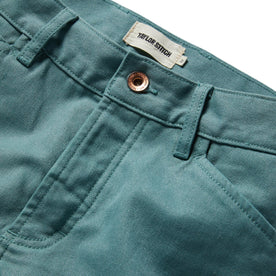 material shot of the button and fly opening of The Chore Pant in Ocean Boss Duck, Bottoms by Taylor Stitch