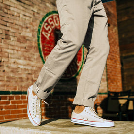 fit model in low-top canvas shoes with The Democratic Foundation Pant in Organic Stone, Bottoms by Taylor Stitch