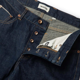 material shot of open button fly of The Democratic Jean in Rinsed Organic Selvage, Bottoms by Taylor Stitch