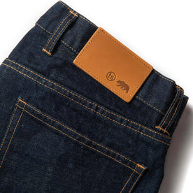 material shot of leather patch of The Democratic Jean in Rinsed Organic Selvage, Bottoms by Taylor Stitch