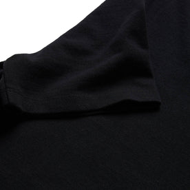 material shot of the sleeve on The Heavy Bag Tee in Black, Knits by Taylor Stitch