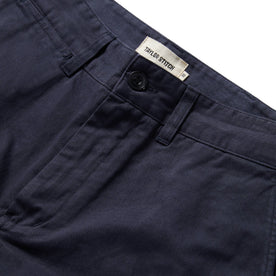 material shot of the button fly of The Slim Foundation Pant in Dark Navy, Bottoms by Taylor Stitch