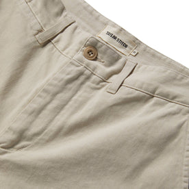 material shot of the front placket and waistband of The Slim Foundation Pant in Organic Stone, Bottoms by Taylor Stitch