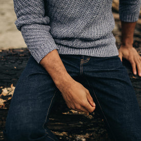 fit model wearing a sweater and The Slim Jean in Rinsed Organic Selvage, Bottoms by Taylor Stitch