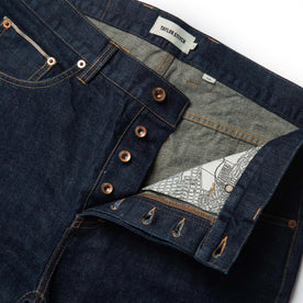 material shot of open front placket of The Slim Jean in Rinsed Organic Selvage, Bottoms by Taylor Stitch