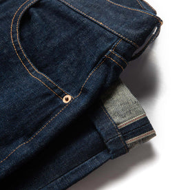 material shot of selvage leg hem of The Slim Jean in Rinsed Organic Selvage, Bottoms by Taylor Stitch