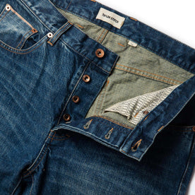 material shot of front open button fly of The Slim Jean in Sawyer Wash Organic Selvage, Bottoms by Taylor Stitch