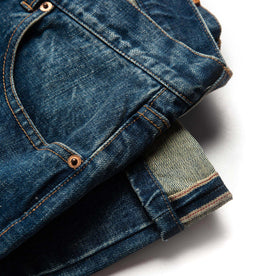 material shot of selvage hem of The Slim Jean in Sawyer Wash Organic Selvage, Bottoms by Taylor Stitch