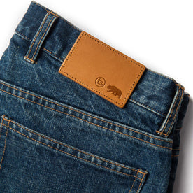 material shot of leather patch of The Slim Jean in Sawyer Wash Organic Selvage, Bottoms by Taylor Stitch