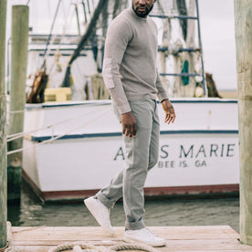 fit model wearing The Chore Pant in Gravel Boss Duck by the docks, Bottoms by Taylor Stitch