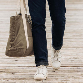 fit model walking in The Demcratic Jean in Wallace Wash Organic Selvage, Bottoms by Taylor Stitch