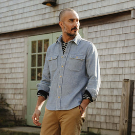 fit model sitting wearing The Division Shirt in Washed Indigo, Wovens by Taylor Stitch