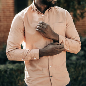 fit model adjusting the cuffs on The Jack in Dried Acorn Oxford, Wovens by Taylor Stitch