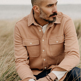 fit model sitting on the ground in The Ledge Shirt in Dusty Coral Twill, Wovens by Taylor Stitch