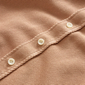 material shot of the buttons on The Ledge Shirt in Dusty Coral Twill, Wovens by Taylor Stitch