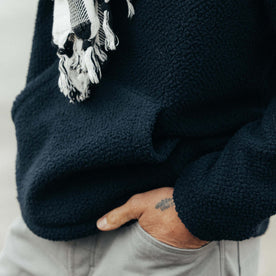 fit model showing the kangaroo pocket on The Nomad Hoodie in Navy Sherpa, Outerwear by Taylor Stitch