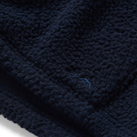 material shot of the TS logo on The Nomad Hoodie in Navy Sherpa , Outerwear by Taylor Stitch