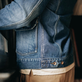 fit model showing the side of The Ryder Jacket in Sun Bleached Denim, Outerwear by Taylor Stitch