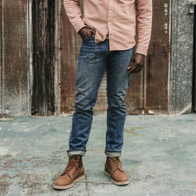 fit model posing in The Slim Jean in Sawyer Wash Organic Selvage, Bottoms by Taylor Stitch