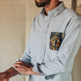 fit model wearing The Atelier and Repairs Jack in Washed Blue Oxford, cuffed sleeved, Wovens by Taylor Stitch