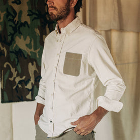 fit model wearing The Atelier and Repairs Jack in Washed White Oxford, cuffed, hands in pockets, Wovens by Taylor Stitch