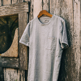 material shot outdoors of The Botanical Dye Tee in Grey, hanging on shed, Knits by Taylor Stitch