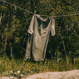 outdoor material shot of The Botanical Dye Tee in Moss, hanging on clothes line, Knits by Taylor Stitch