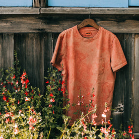 outdoor material shot of The Botanical Dye Tee in Rust, hanging on shed, Knits by Taylor Stitch