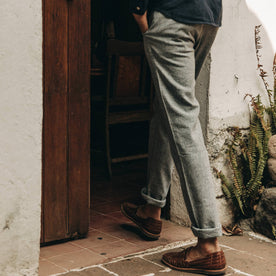 fit model wearing The Easy Pant in Navy Herringbone, cuffed with shoes, walking indoors, Bottoms by Taylor Stitch