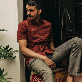 fit model wearing The Havana in Rusted Floral Jacquard, sitting on box, Wovens by Taylor Stitch