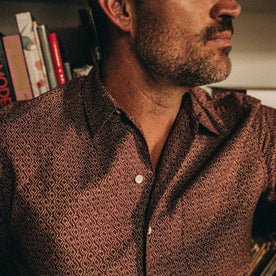 fit model wearing The Short Sleeve Hawthorne in Burgundy Trellis, chest detail, Wovens by Taylor Stitch