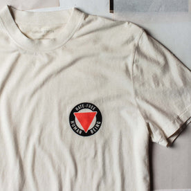 material shot of the graphic logo on The Cotton Hemp Tee in Hate-Free, Knits by Taylor Stitch