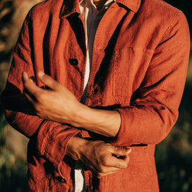 fit model rolling up the sleeves of The Ojai Jacket in Rust Hemp, Outerwear by Taylor Stitch