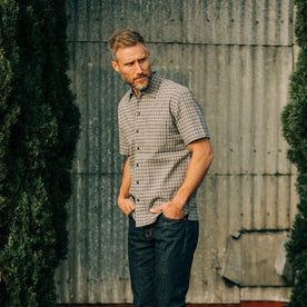 fit model posing in The Short Sleeve Hawthorne in Navy Stripe, Wovens by Taylor Stitch